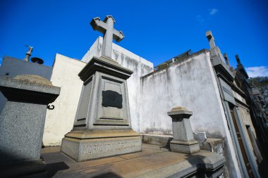 View of a tomb with a cross clipart