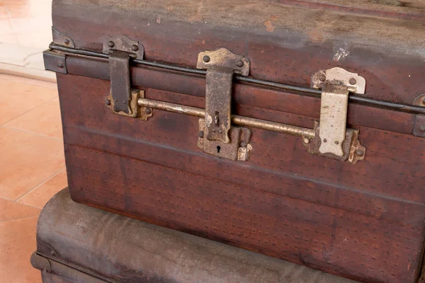 Old wooden antique travel chest used in the past in a stack. Toned image as vintage background. — Stock Photo, Image