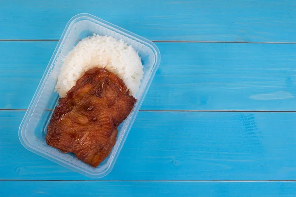 School lunch box rice and roast chicken in transparent box. Box lunch delivery service or take home lunch box.