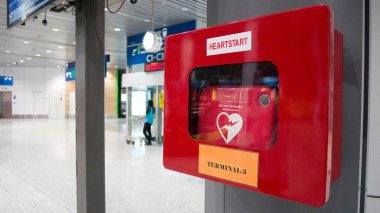 KUALA LUMPUR - MAR 23: HeartStart defibrillator install in public location in the departure of the Kuala Lumpur International Airport for prepared to provide life-saving cardiopulmonary resuscitation in Malaysia 23 March 2017. clipart