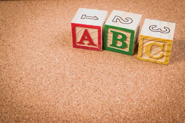 Wood letter blocks alphabet ABC for practice english alphabet for kids on school desk. ABC practice concept.