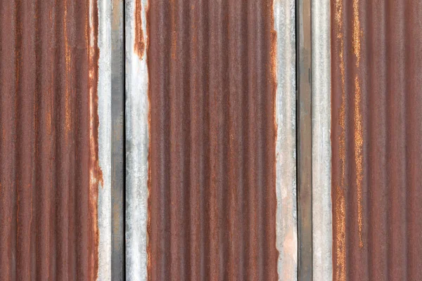 Dark brown used zinc or rusty zinc wall for background. — Stock Photo, Image
