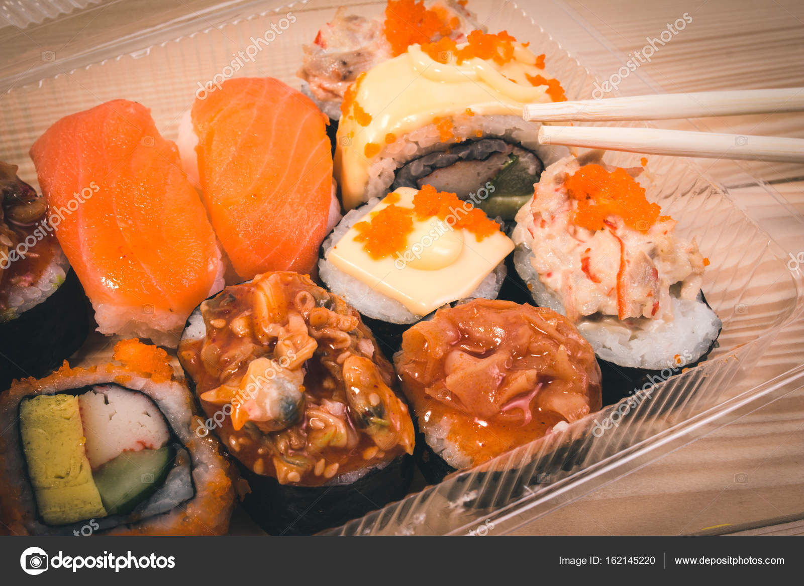 Japanese food Sushi in plastic box on Japanese table. Set of Sushi ... Japanese food Sushi in plastic box on Japanese table. Set of Sushi ...