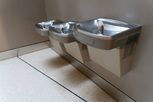 Free drinking water or drinking fountain for traveler in the international airport. Public drinking water concept.