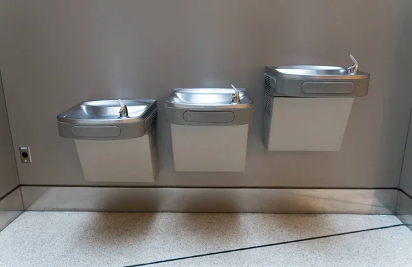 Free drinking water or drinking fountain for traveler in the international airport. Public drinking water concept.