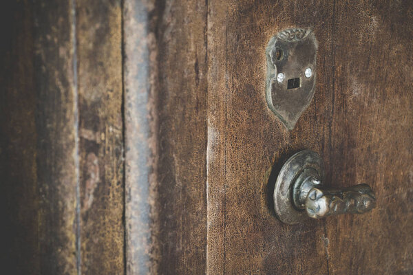 Close up of old vintage copper rusty keyhold safe lock on metal door safe. Old door metal keyhold with vintage effect.