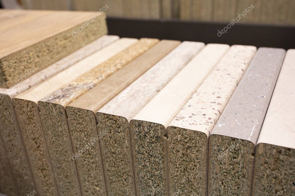 Different types of wooden materials for a kitchen - example set for furniture manufacture. Photo with selective focus