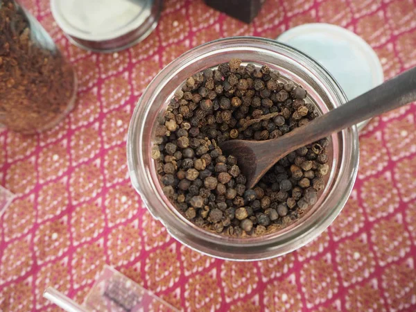 Black pepper in a glass — Stock Photo, Image