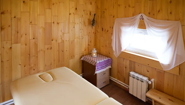 massage cabinet.  couches and candles. The house is made of natural timber. Warm  cozy atmosphere.