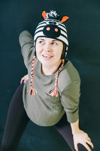 Smiling young girl in funny hat — Stock Photo, Image