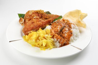 Traditional Malaysian Indian food white rice cabbage vegetable meat deep fried chopped chicken leg topped up with spicy mix gravy white background clipart