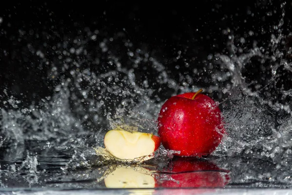 Two red apples in water splash — Stock Photo, Image