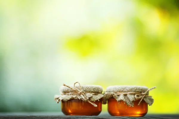 Jars of honey in eco-style — Stock Photo, Image