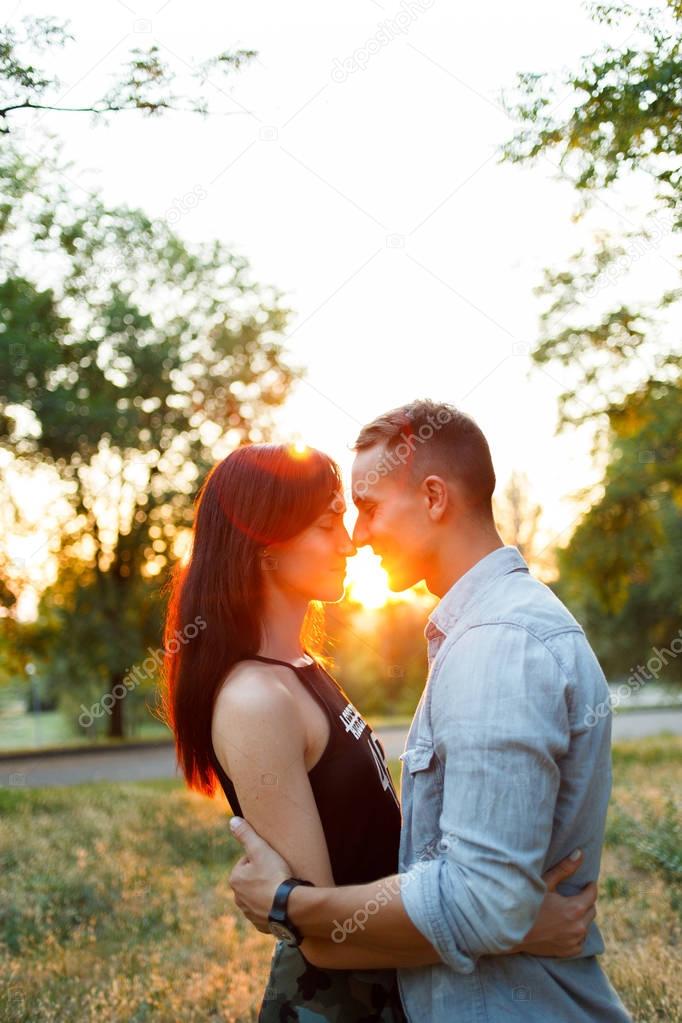 Couple kissing happiness fun. Interracial young couple