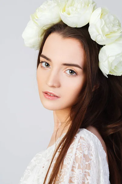 Girl with clean skin and beautiful face and roses hairstyle Royalty Free Stock Images