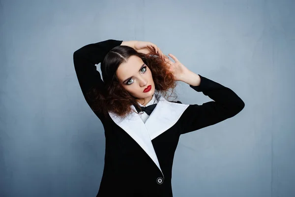Model in black stylish suit with red lipstick Royalty Free Stock Images