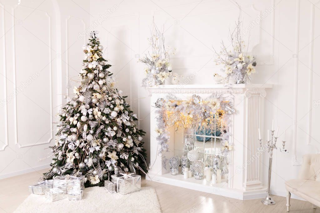 Beautiful Christmas Decorations On The White Fireplace
