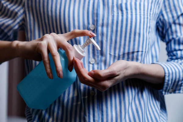 Hand sanitizer Coronavirus spreading COVID-19 prevention alcohol gel rub for hand hygiene corona virus protection. Woman using soap to clean hands.