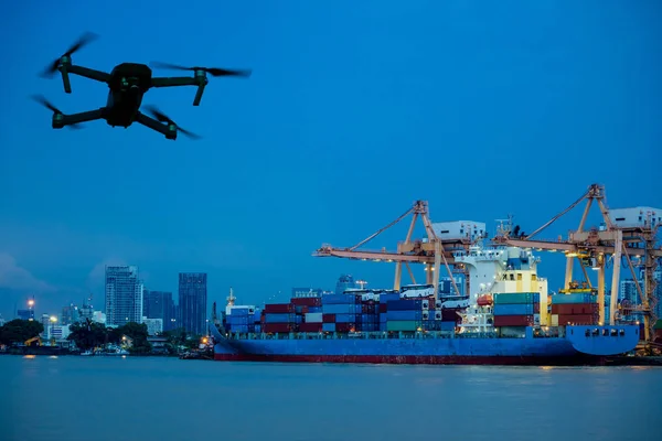 Drone and cargo ship loading at shipping port