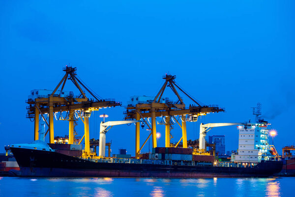 Shipping port. Cargo ship loading by crane