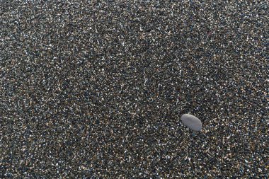 Bir çakıl yığınının yakın plan çekiminden oluşan arkaplan