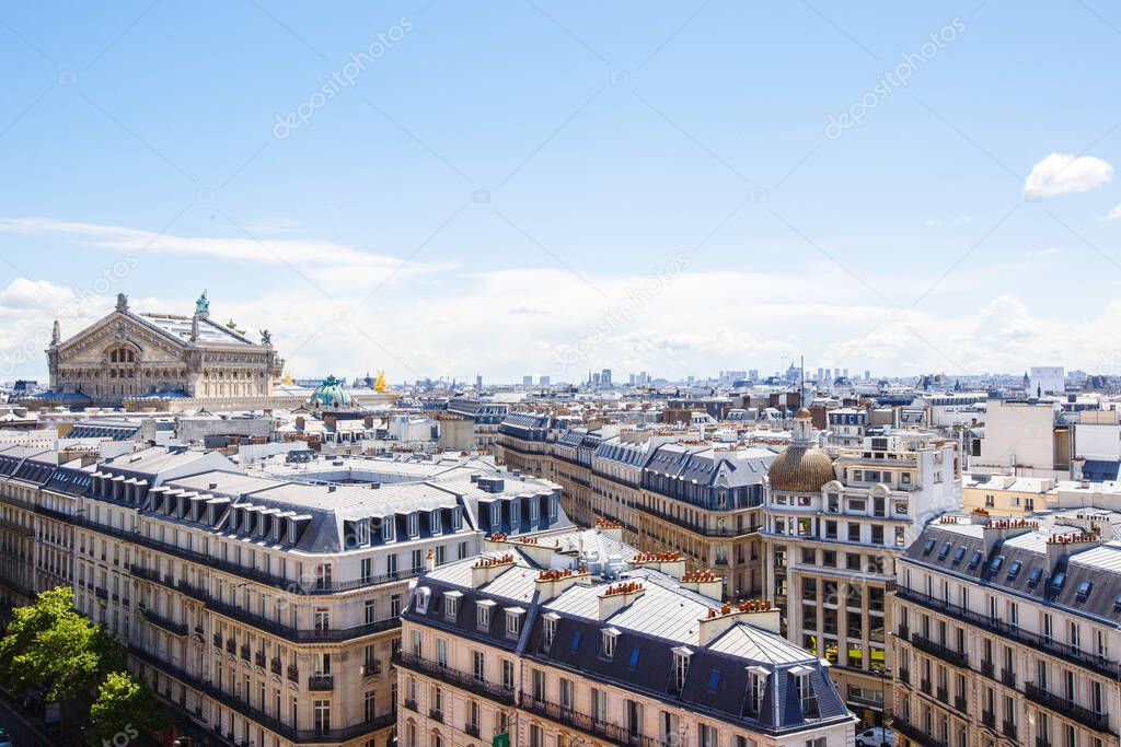 Paris, France - May 20, 2015: The Opera Garnier of Paris, France. The National Academy of Music, Paris Opera, Royal Academy of Music and Dance. Many tourists near the building in spring sunny day