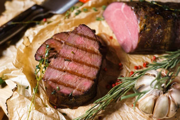 Grilled meat on kraft paper — Stock Photo, Image