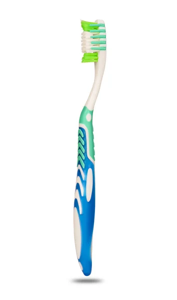 Зубная щётка на белом фоне — стоковое фото