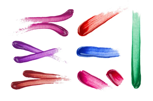 Set verschiedener Lippenstift- und Nagellackstriche auf weißem Backgro — Stockfoto