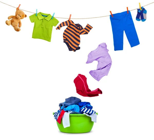 Clothing falls from laundry line in wash bowl on white — Stock Photo, Image