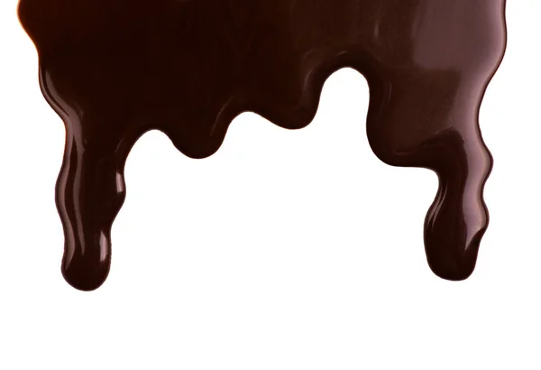 Melted chocolate dripping on white background — Stock Photo, Image