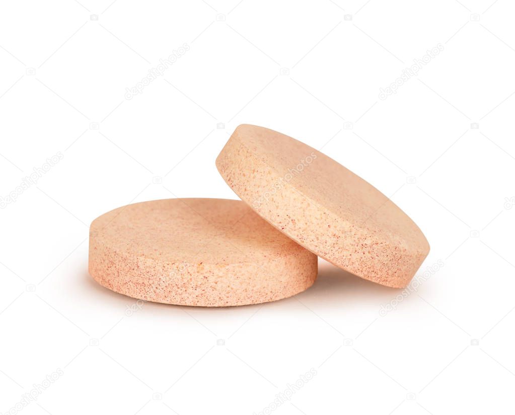 close-up of two vitamins pills isolated on white background