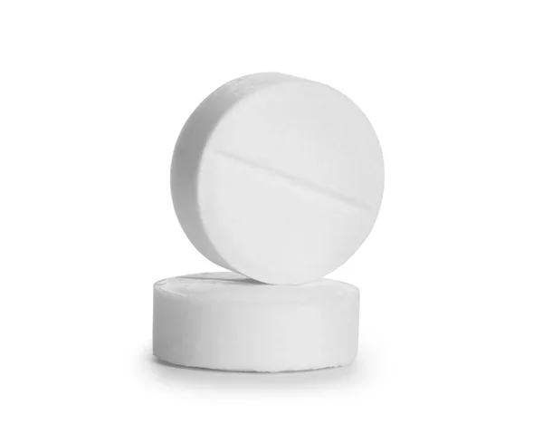 Primo piano di due pillole isolate su sfondo bianco — Foto Stock