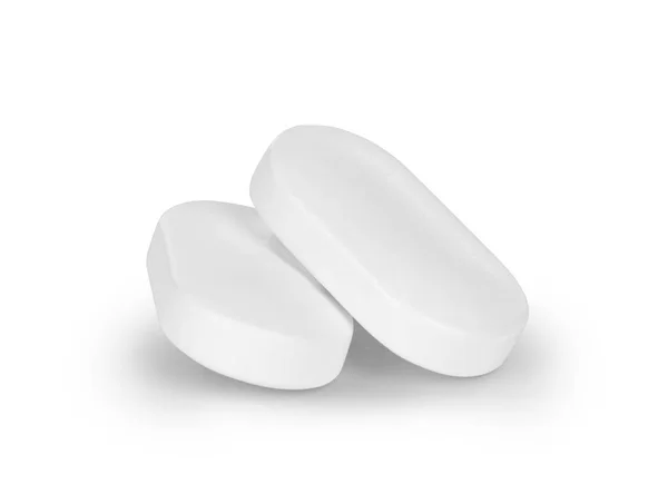 Close-up de duas pílulas isoladas em fundo branco — Fotografia de Stock