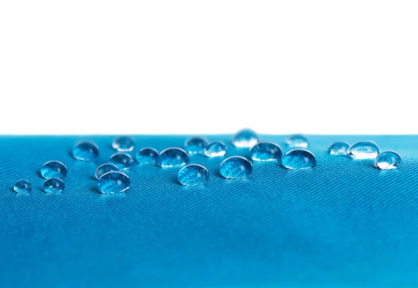 Blauwe waterdichte stof met waterdrops — Stockfoto