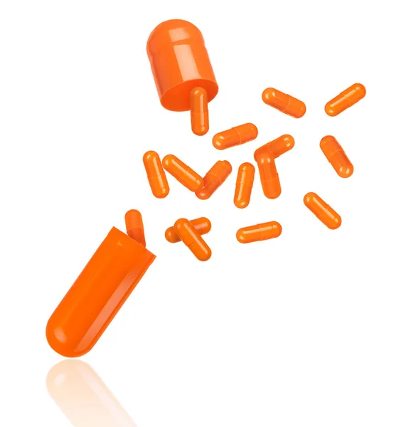 Las pastillas salen volando de la cápsula médica. Imagen conceptual —  Fotos de Stock