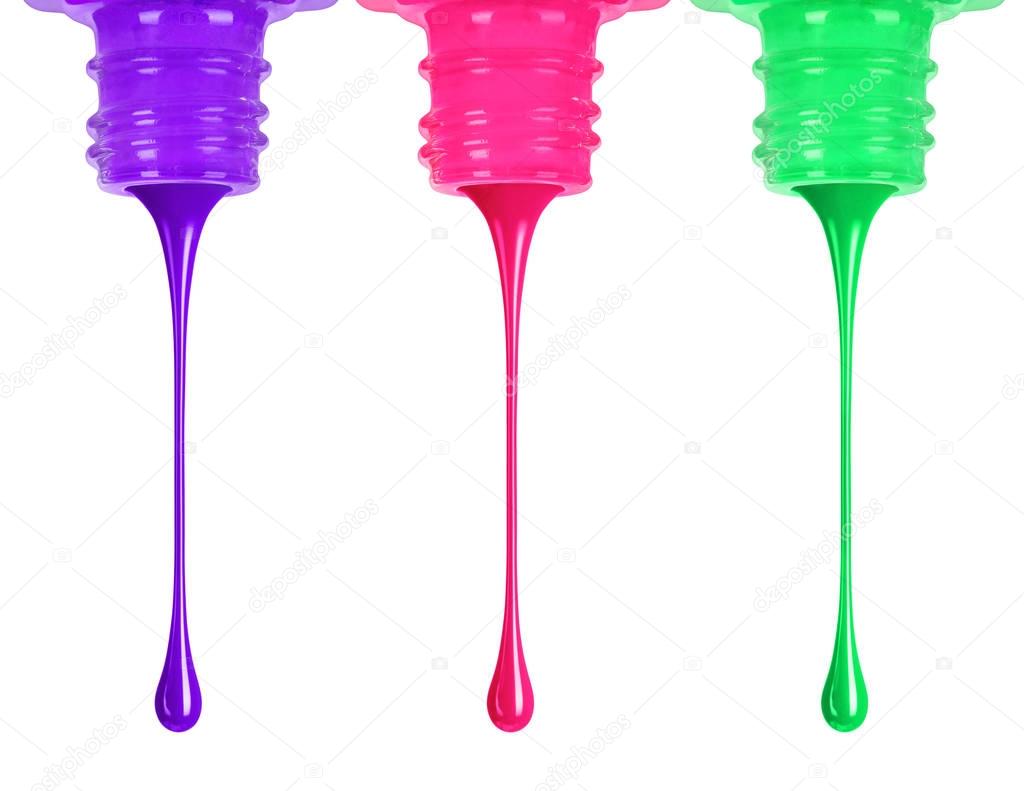 Bright drops of nail polish flow out of the container, isolated 