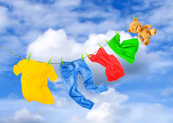 Laundry line with colored clothes — Stock Photo, Image