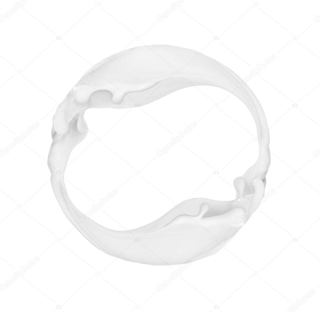 Splashes of milk in a circular motion, isolated on white