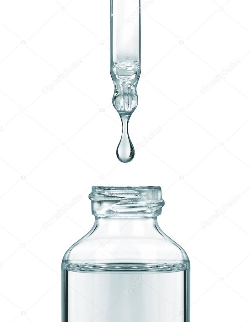 Drop falls from a pipette into a cosmetic bottle
