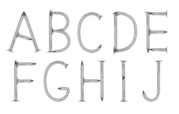 Alphabet réalisé à partir de clous sur fond blanc (partie 1  ). — Photo
