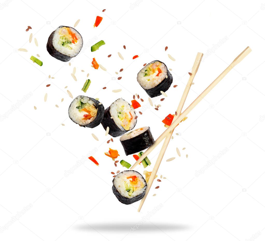 Pieces of sushi frozen in the air isolated on white background