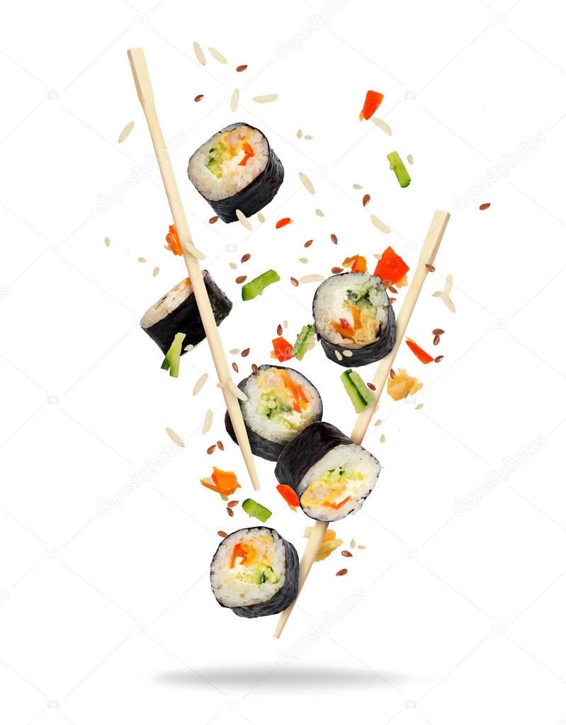 Pieces of sushi frozen in the air on white background