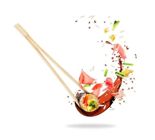 Piece of sushi sandwiched between chopsticks with splashes of soy sauce — Stock Photo, Image