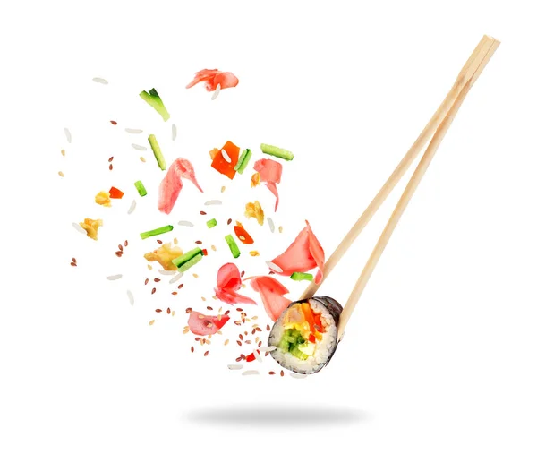 Piece of sushi sandwiched between chopsticks, isolated on white — Stock Photo, Image