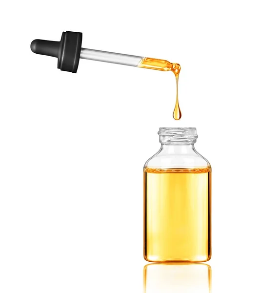 Drop falls from a pipette into a cosmetic bottle — Stock Photo, Image