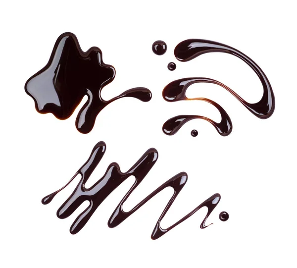 Conjunto de padrões pintados de chocolate close-up, isolado em branco — Fotografia de Stock