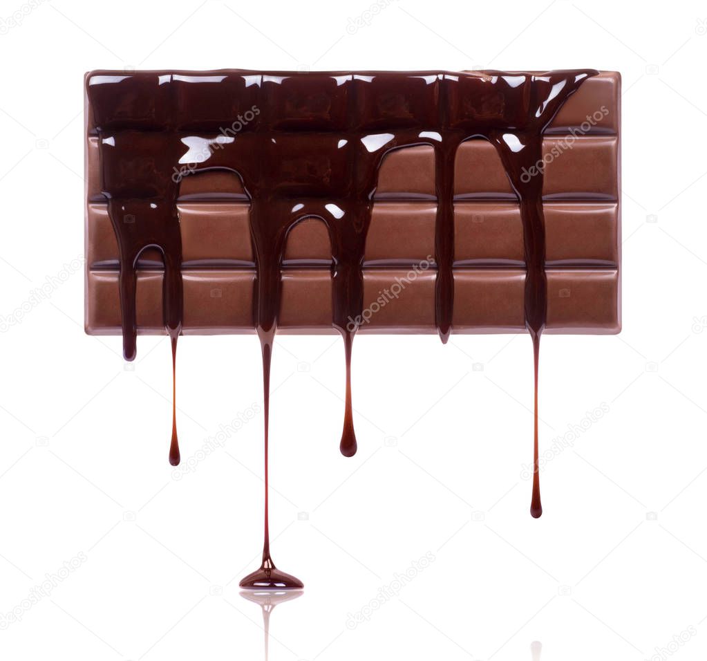 Chocolate bar is poured with chocolate on white background 