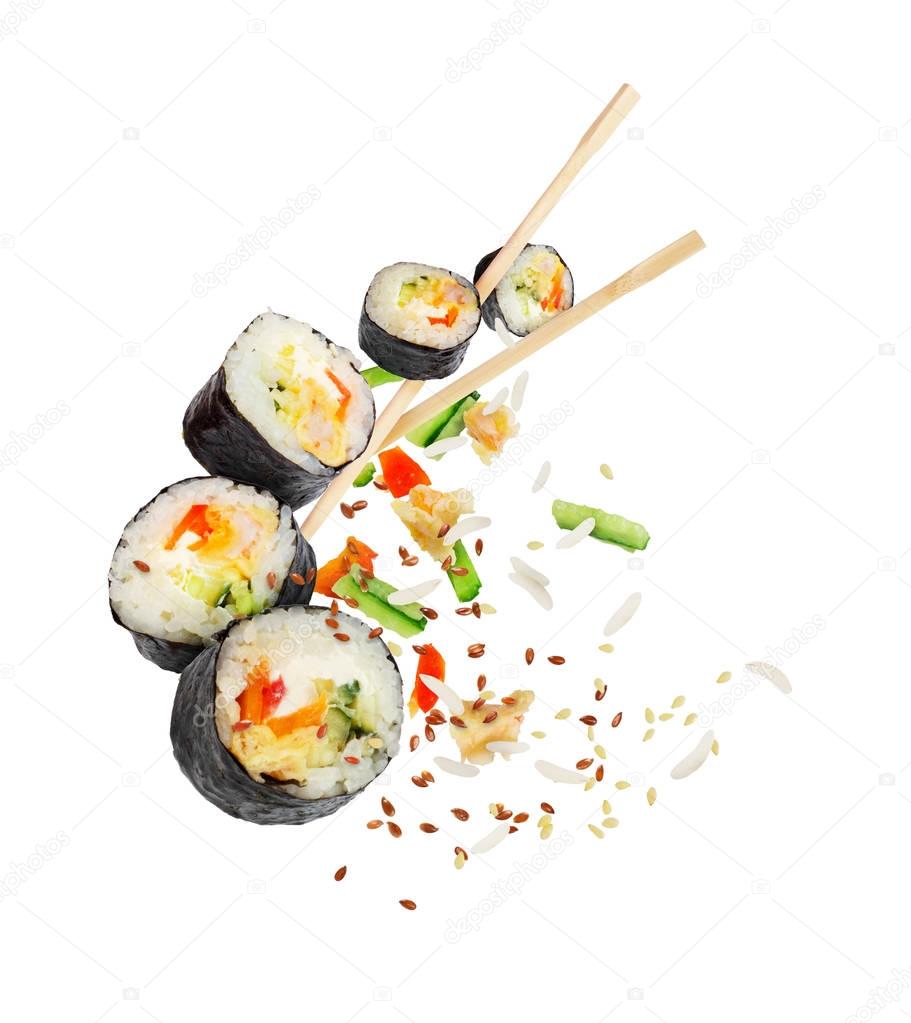 Sushi pieces with chopsticks frozen in the air isolated on white