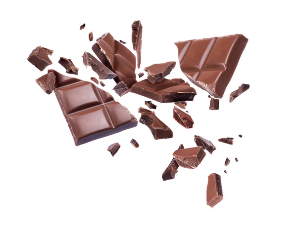 Chocolate broken into pieces in the air on a white background — Stock Photo, Image